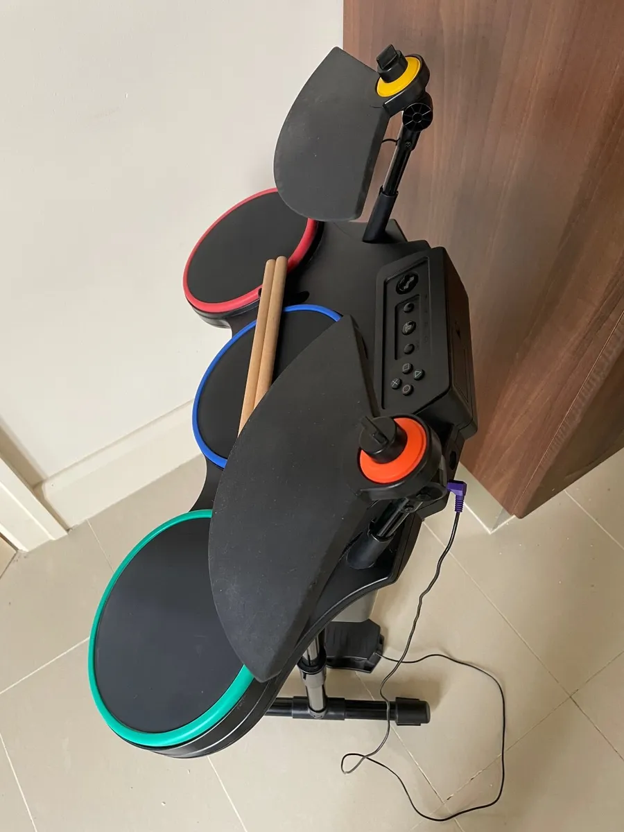 Playstation 3 with games and Guitar Hero drum kit - Image 4