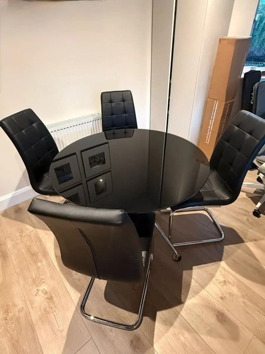 Black glass dining table, chrome legs and 4 chairs - Image 1