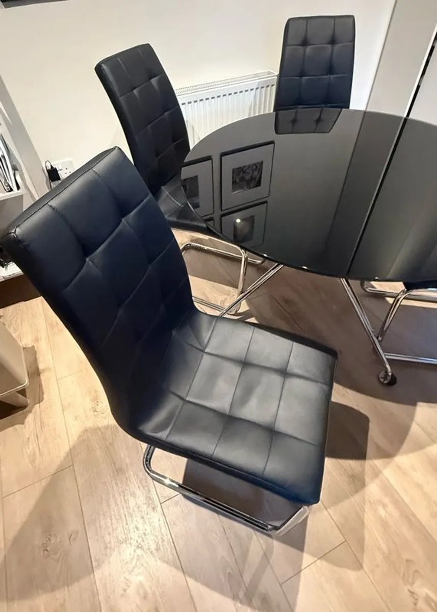 Black glass dining table, chrome legs and 4 chairs - Image 2