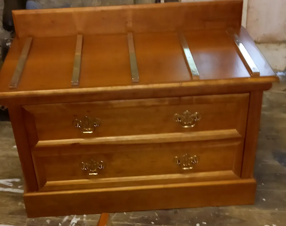 Chest of drawers with suitcase set down on top - Image 2