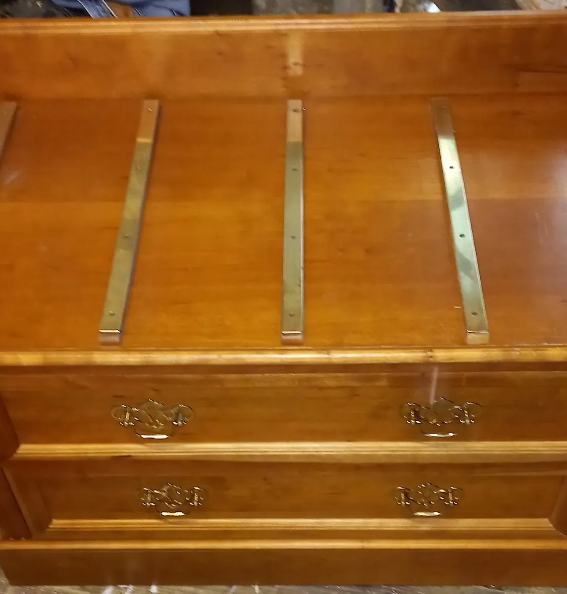 Chest of drawers with suitcase set down on top - Image 3