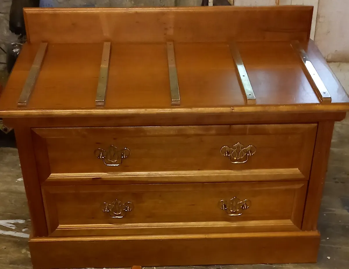Chest of drawers with suitcase set down on top - Image 4