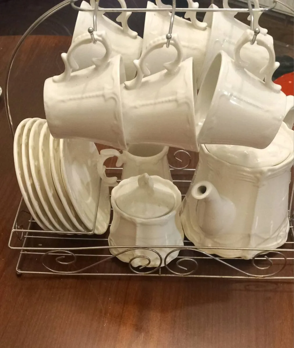 Coffee set on stand.