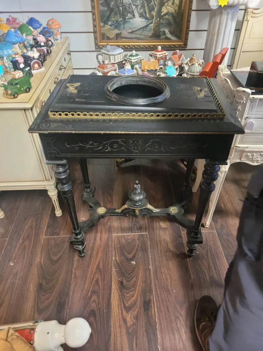 This is a 19th-century French ebonized jardinière