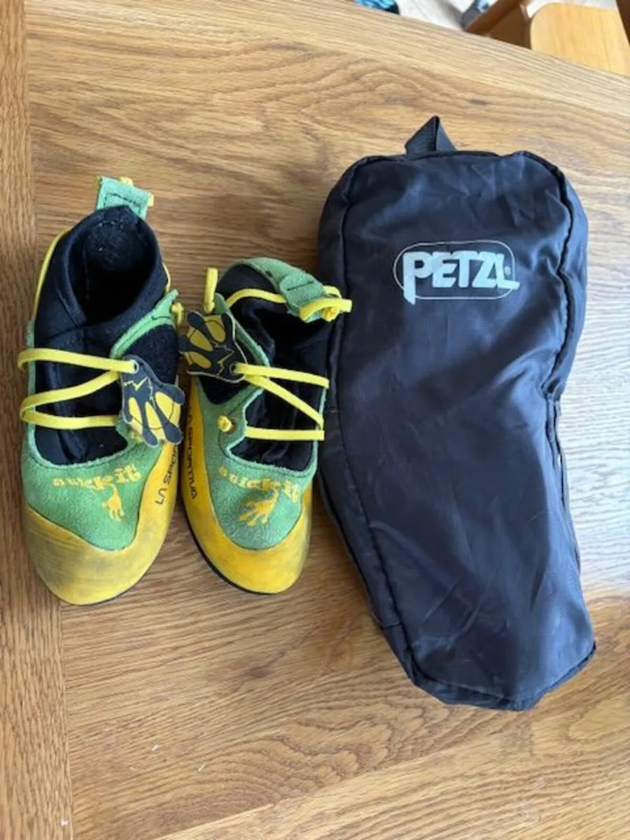 climbing shoes and harness