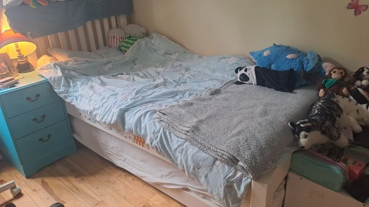 Single bed with trundle bed underneath