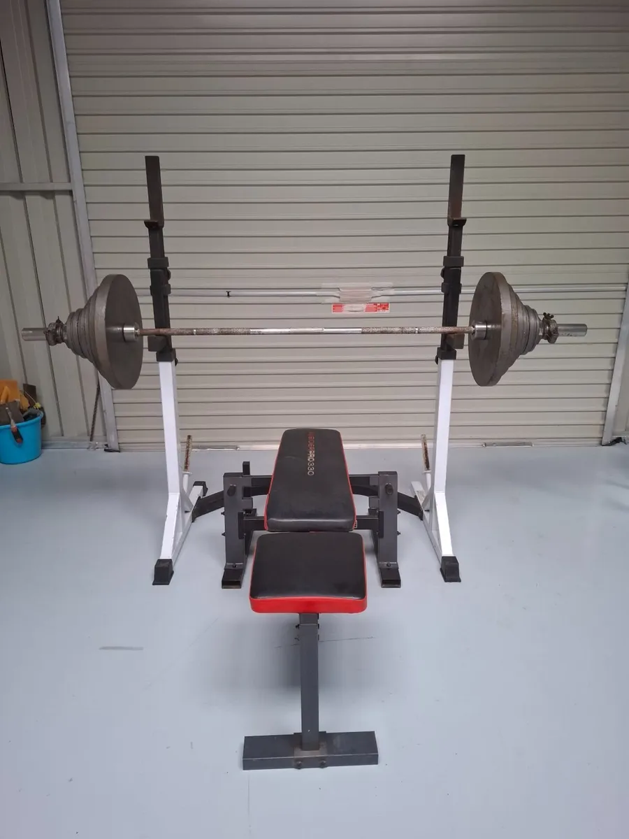 140kg Olympic weight set with squat rack and bench - Image 1