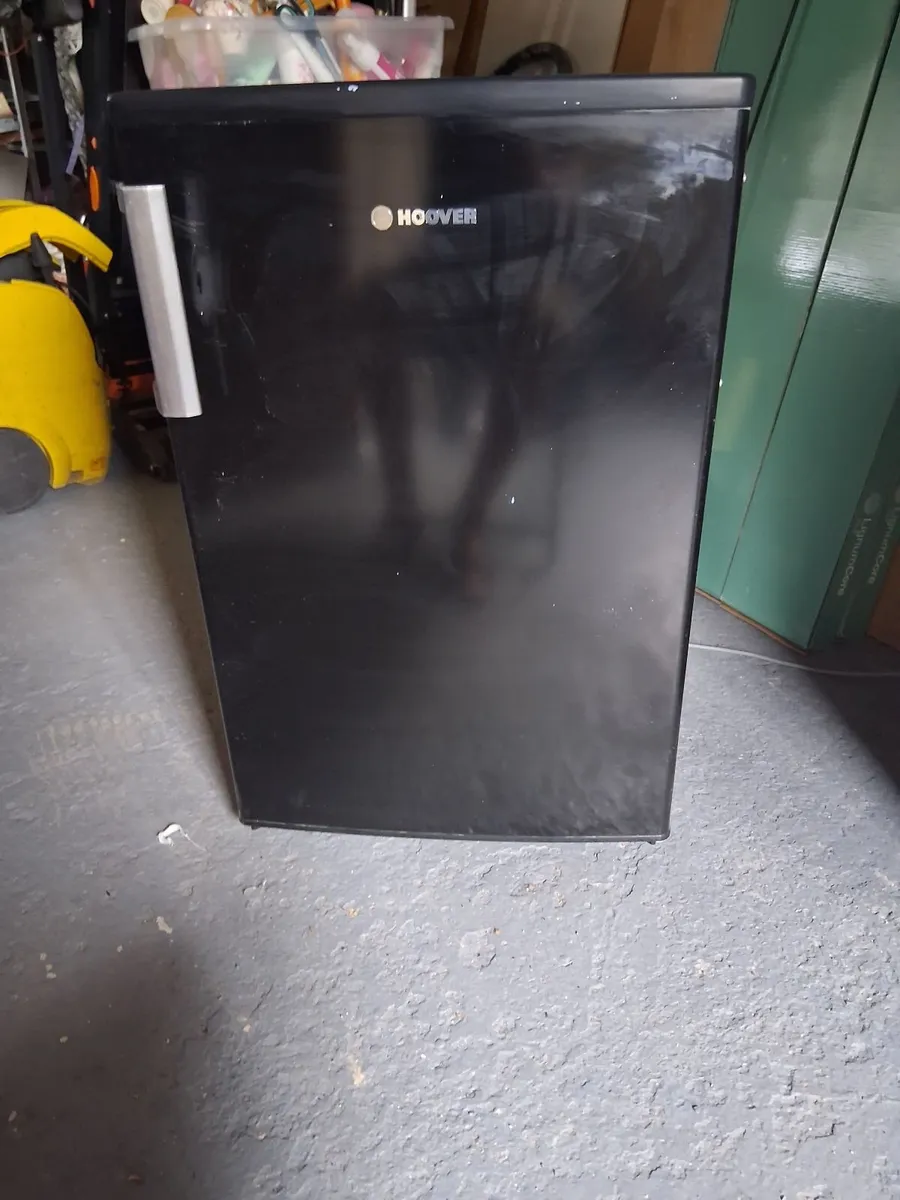 An under counter black Hoover fridge. - Image 1