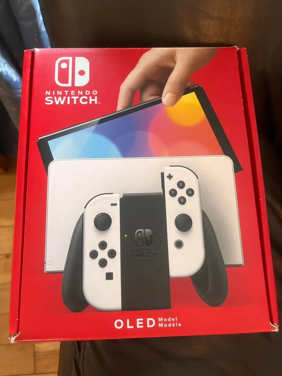 Nintendo switch oled includes 4 games - Image 1