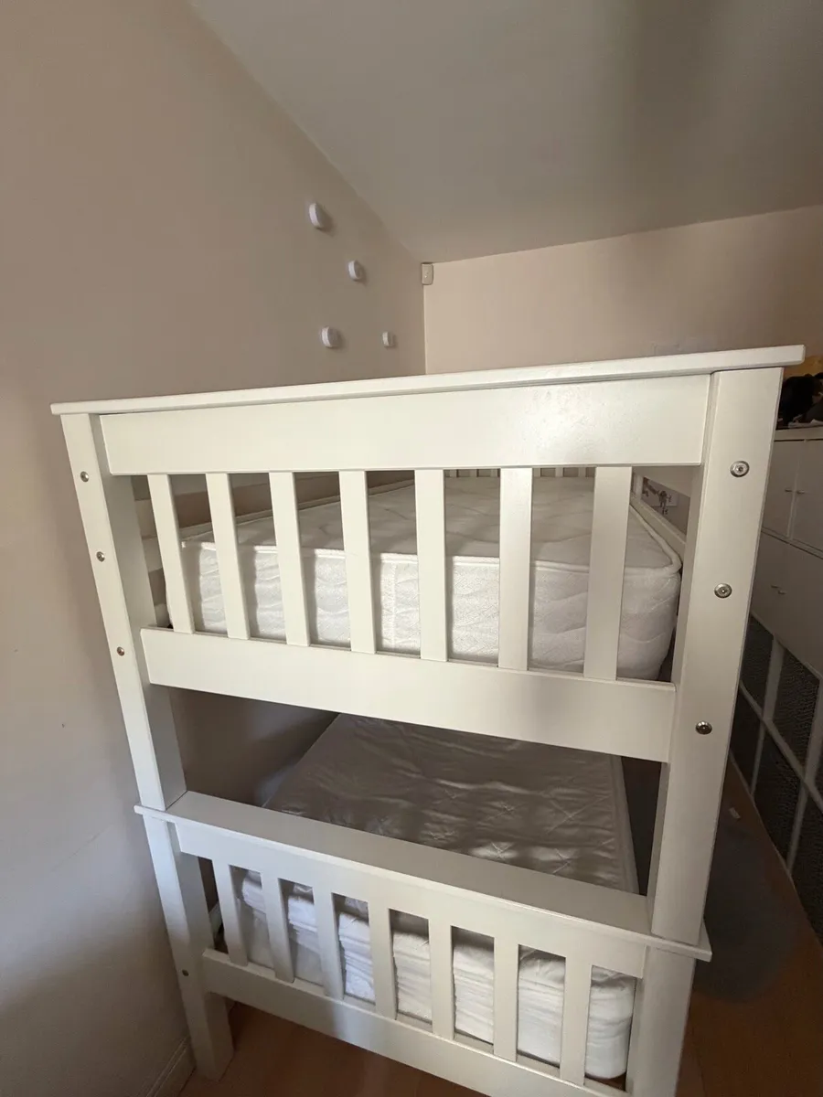 White wooden bunk bed with mattresses. - Image 2