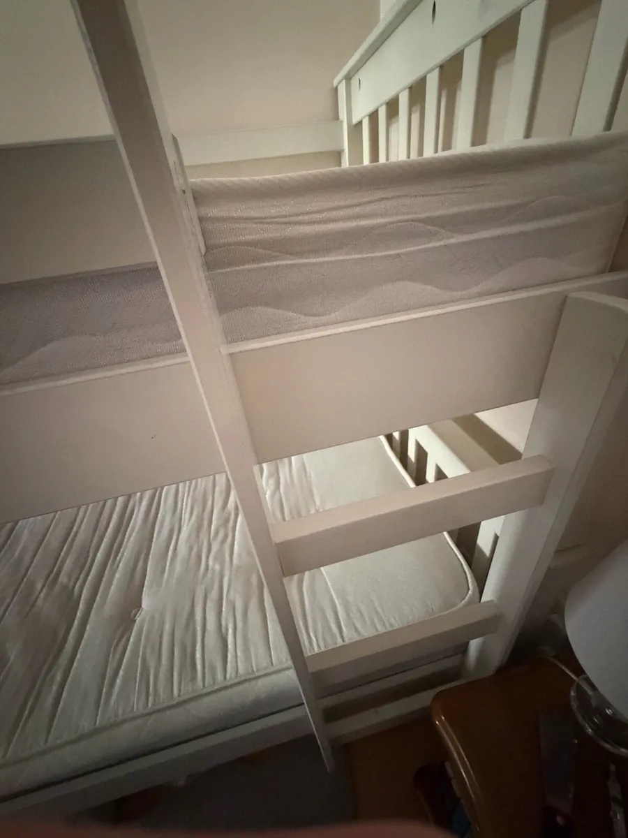 White wooden bunk bed with mattresses. - Image 4