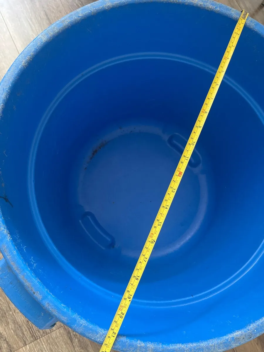 A blue hard plastic barrel or container - Image 1