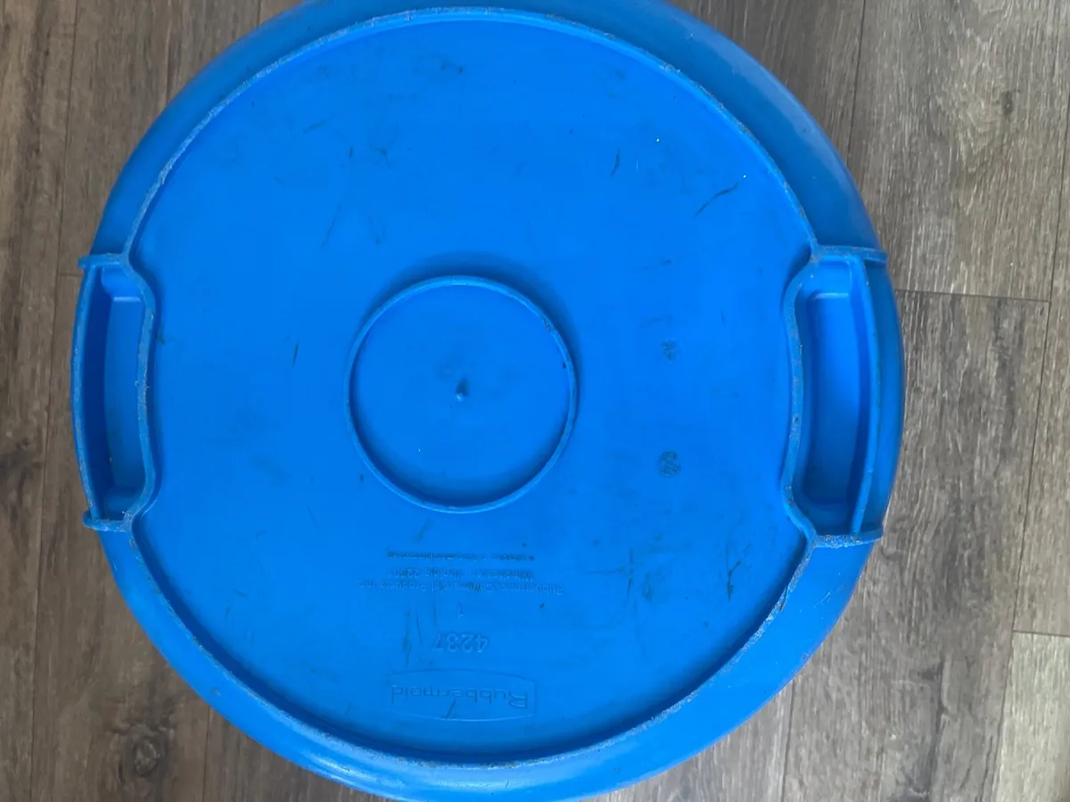 A blue hard plastic barrel or container - Image 4
