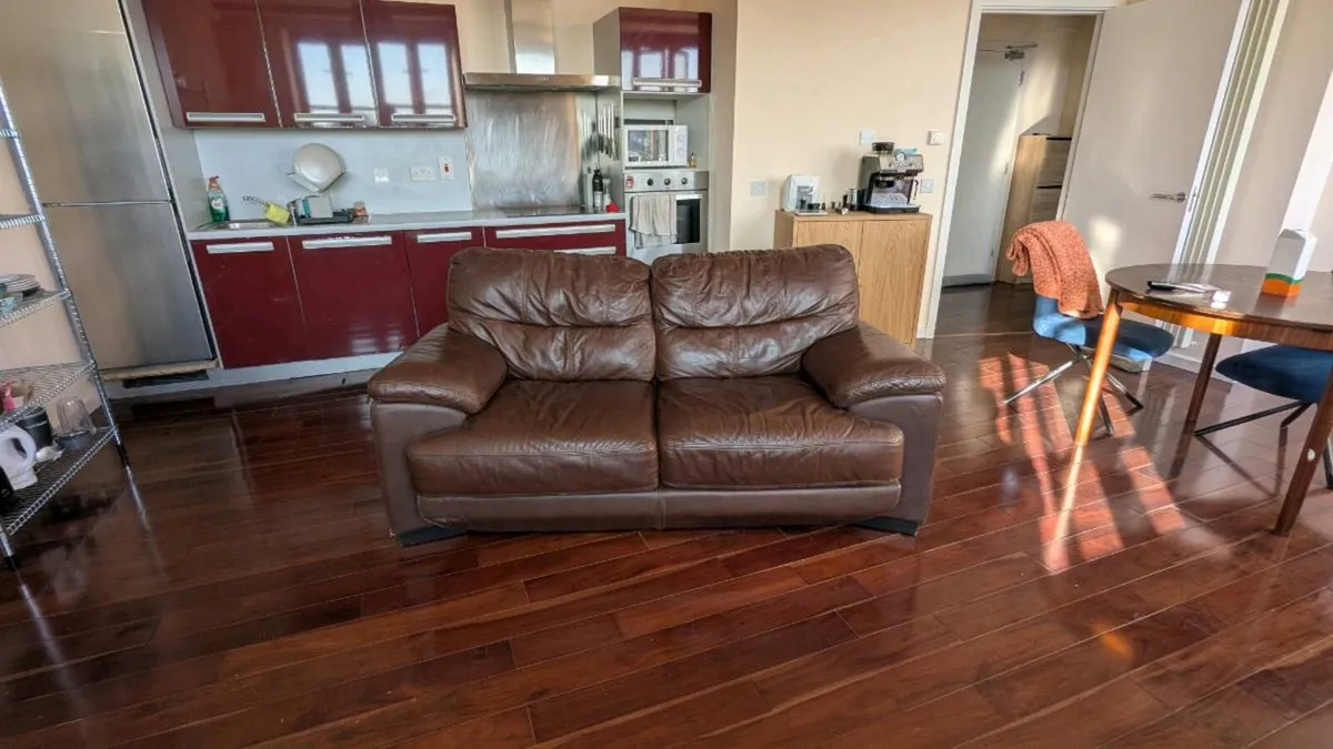 Brown leather 2-seater sofa – good condition - Image 1