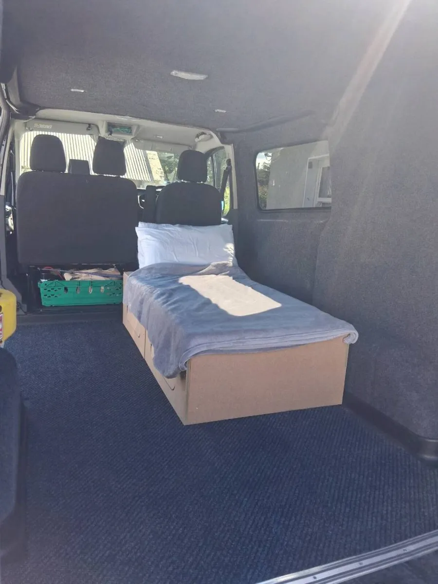 Sliding camper seat bed storage - Image 1