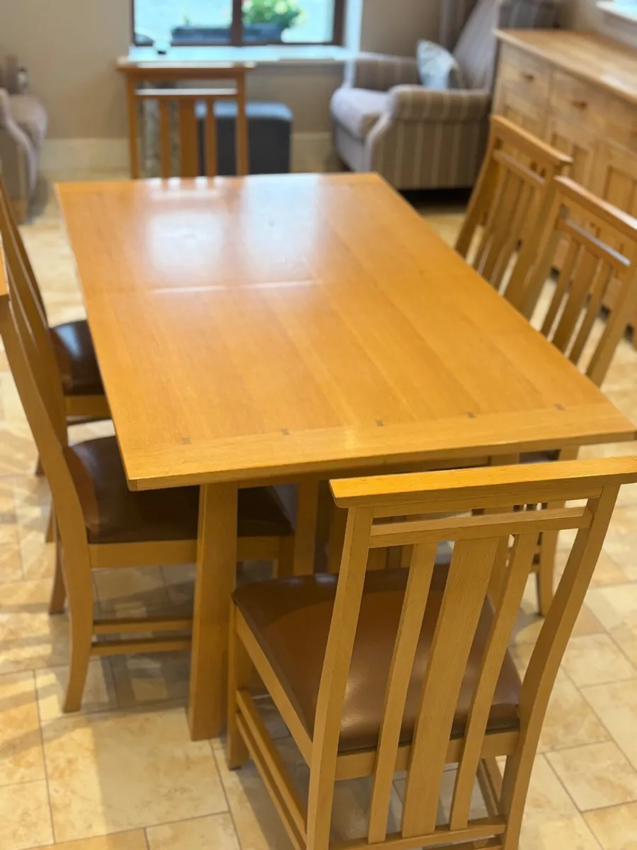 Kitchen table and 8 chairs. - Image 1