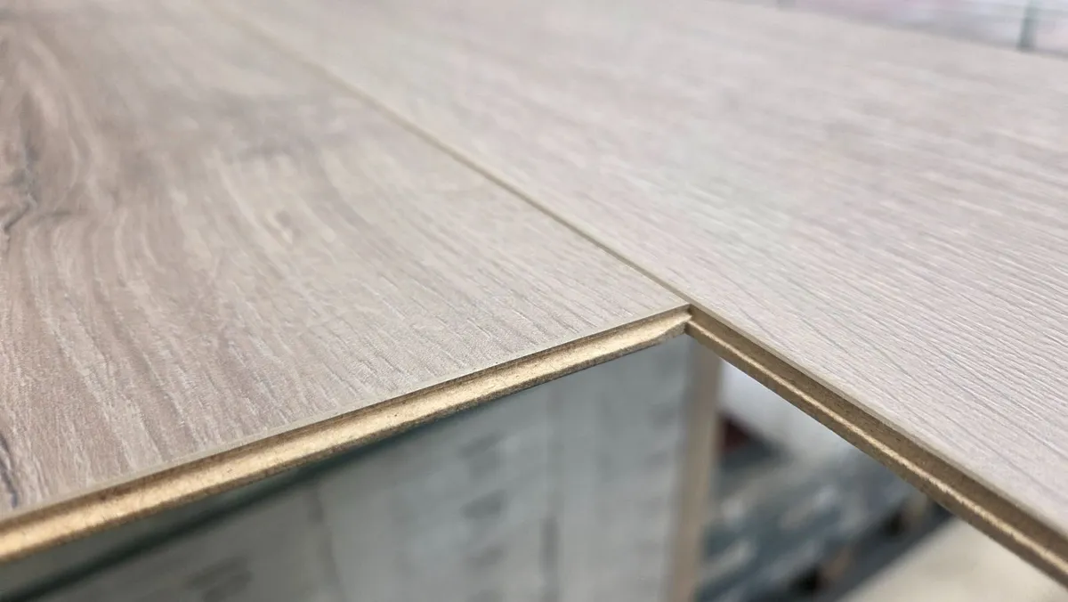 8mm laminated click flooring Delivered - Image 2