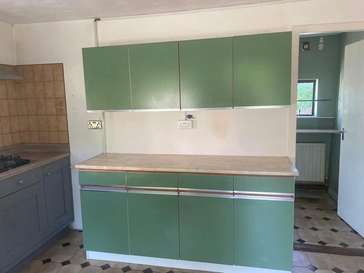 Original 1970s avocado green kitchen cabinets