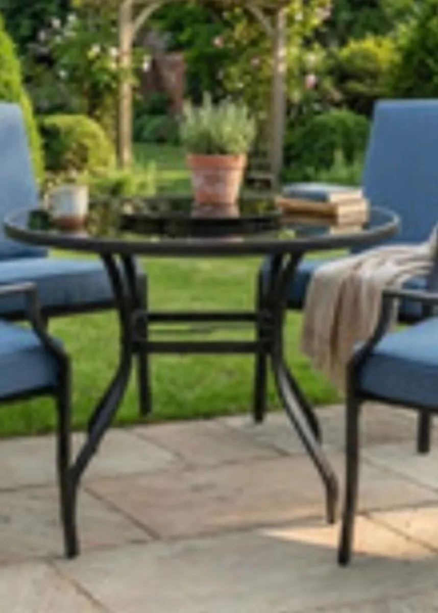 Black round glass garden table + 2  bucket chairs - Image 1