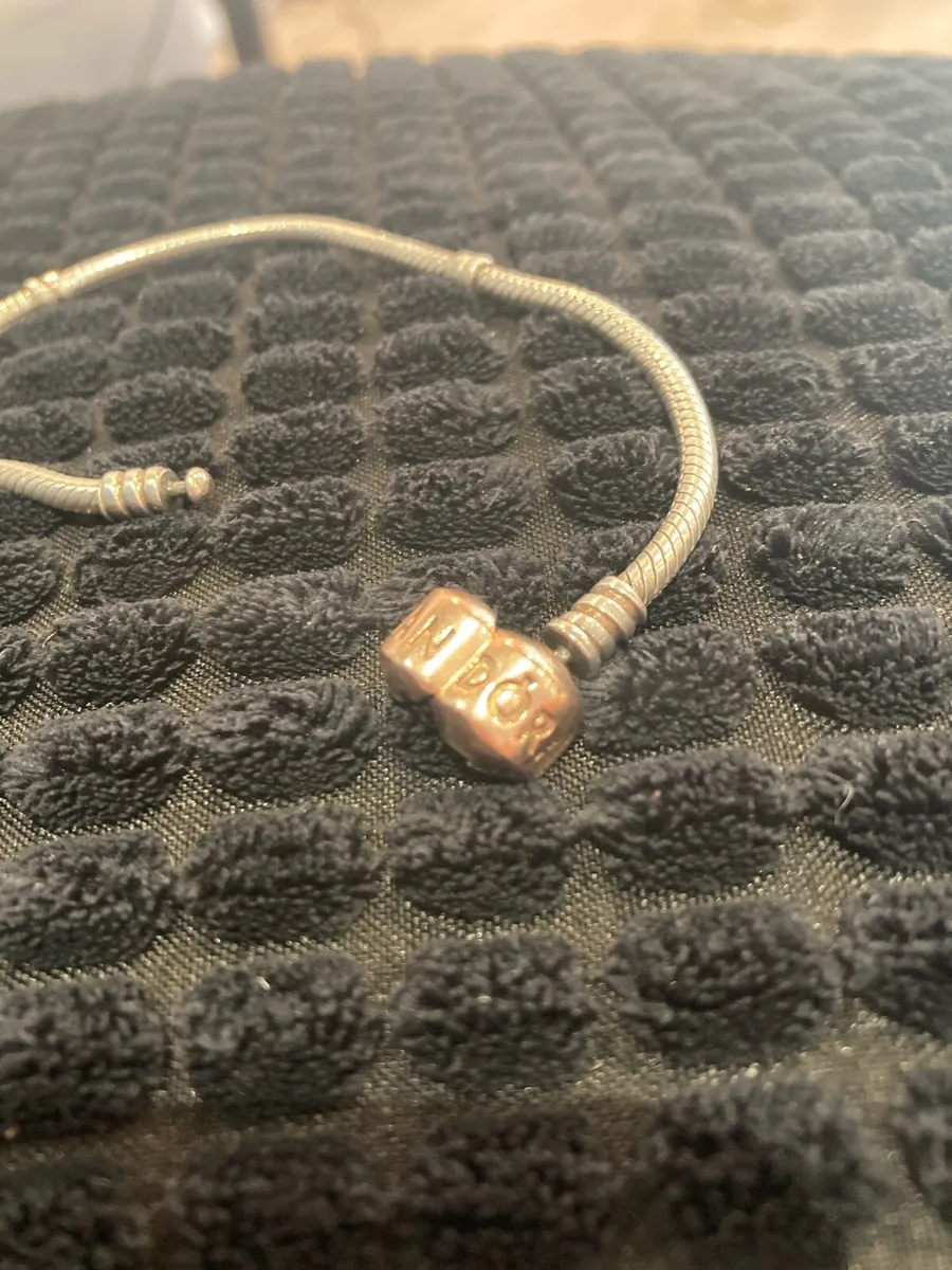 Silver Pandora bracelet with gold tone lock - Image 2