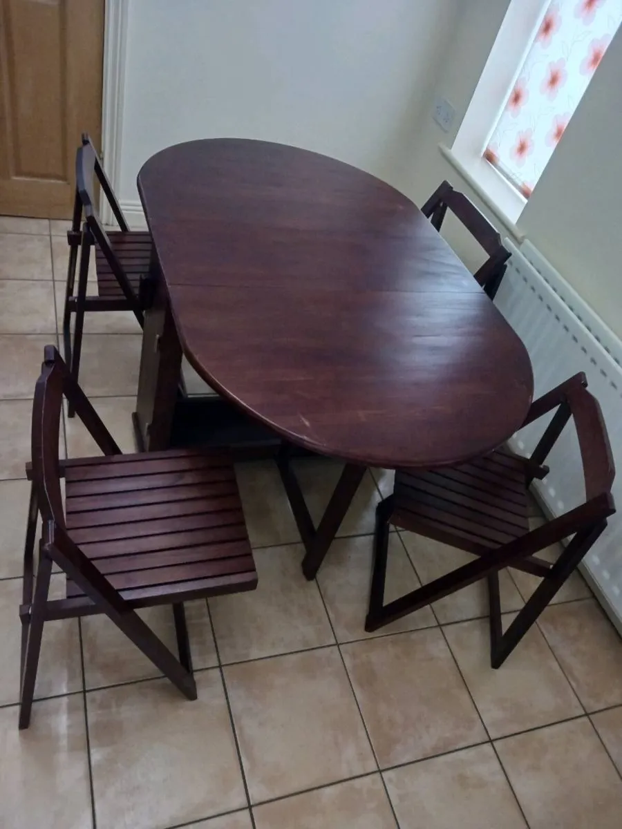 Folding dining table and chairs - Image 1