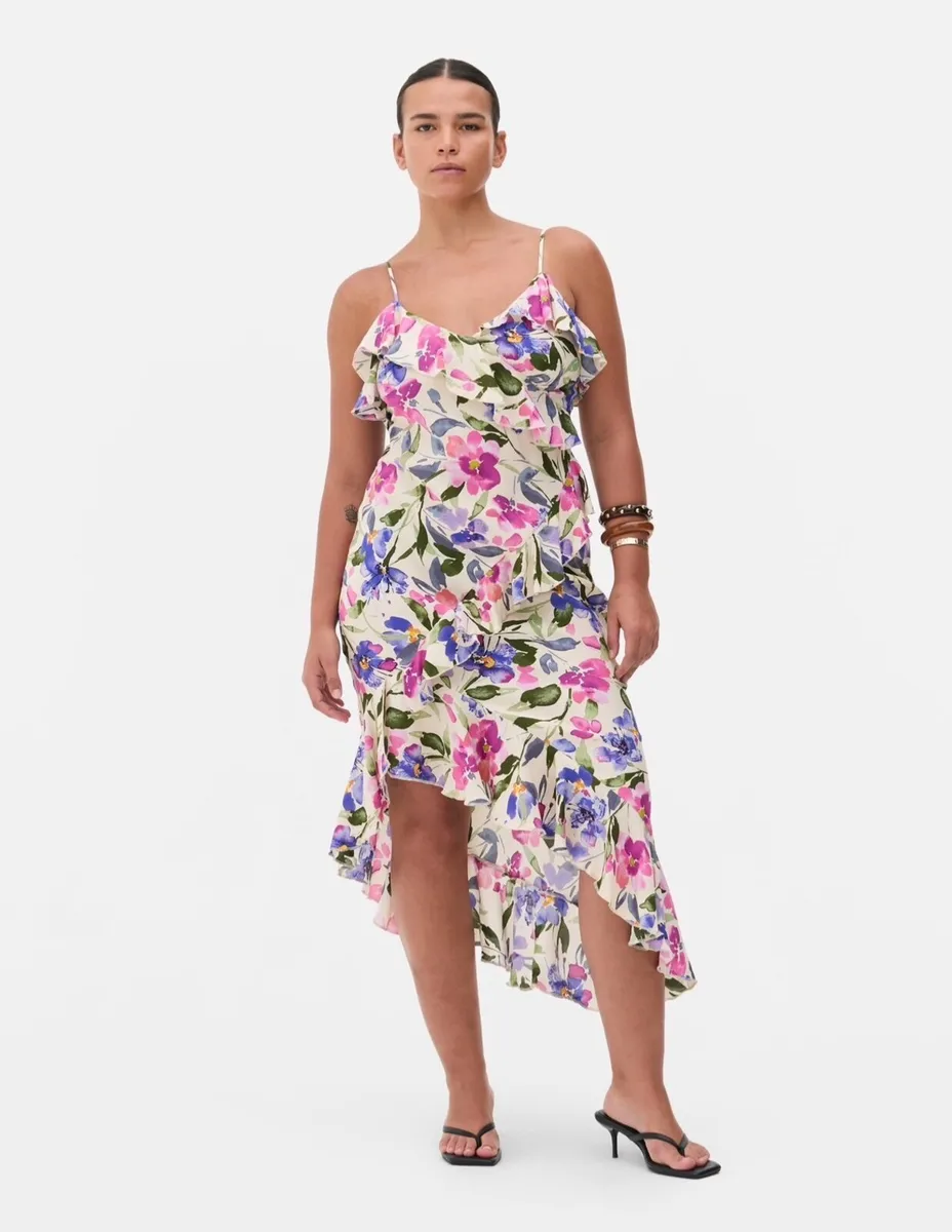New floral ruffle dress features a vibrant asymmet