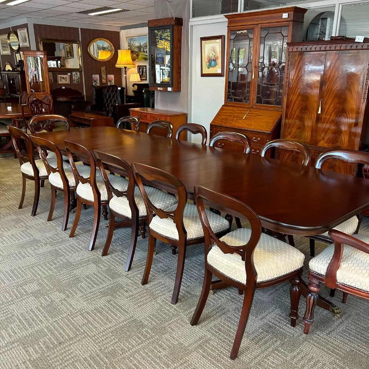 A stunning mahogany dining table with 14 chairs - Image 1