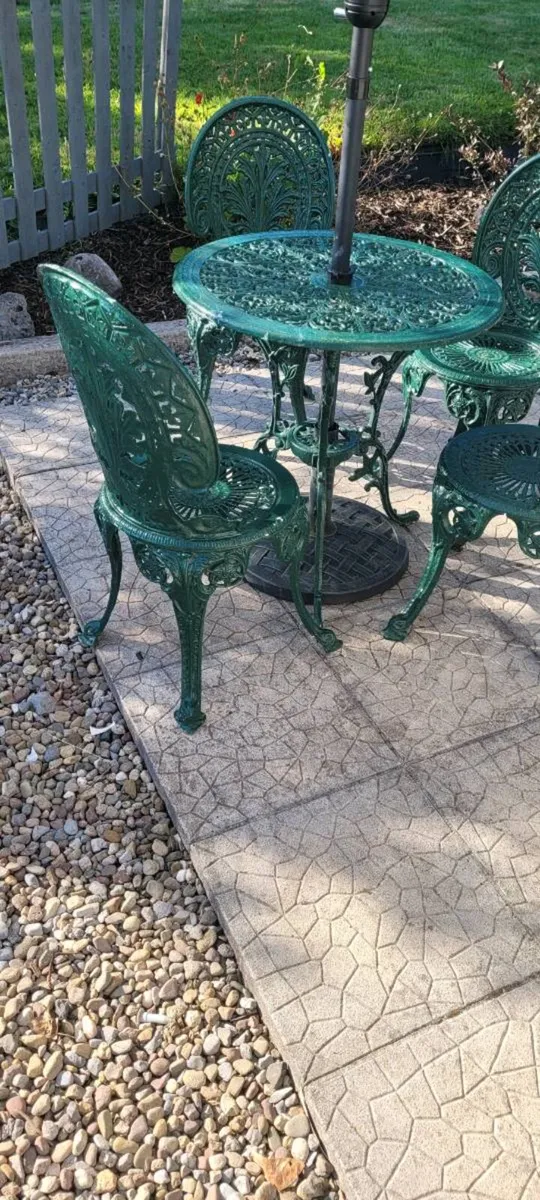 Cast iron table and 4 chairs