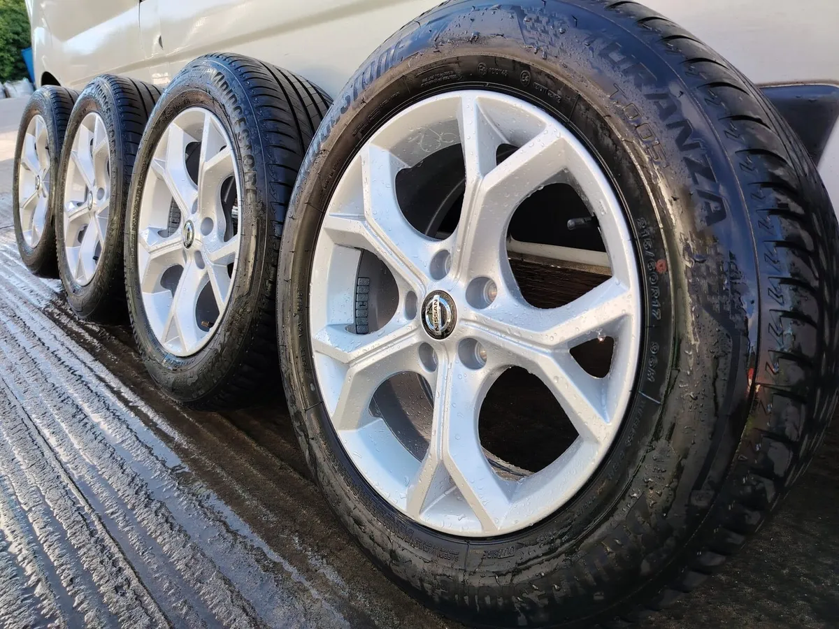 17" Nissan alloy wheels, Bridgestone tyres - Image 1