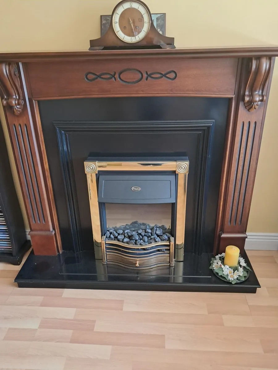 Mahogany Fireplace with inbuilt electric fire - Image 1