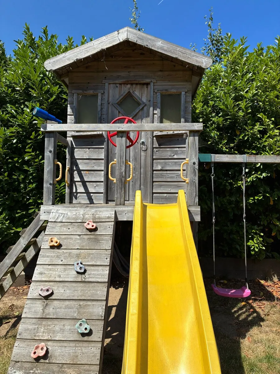 Treehouse with swings climbing wall gym bar slide - Image 1