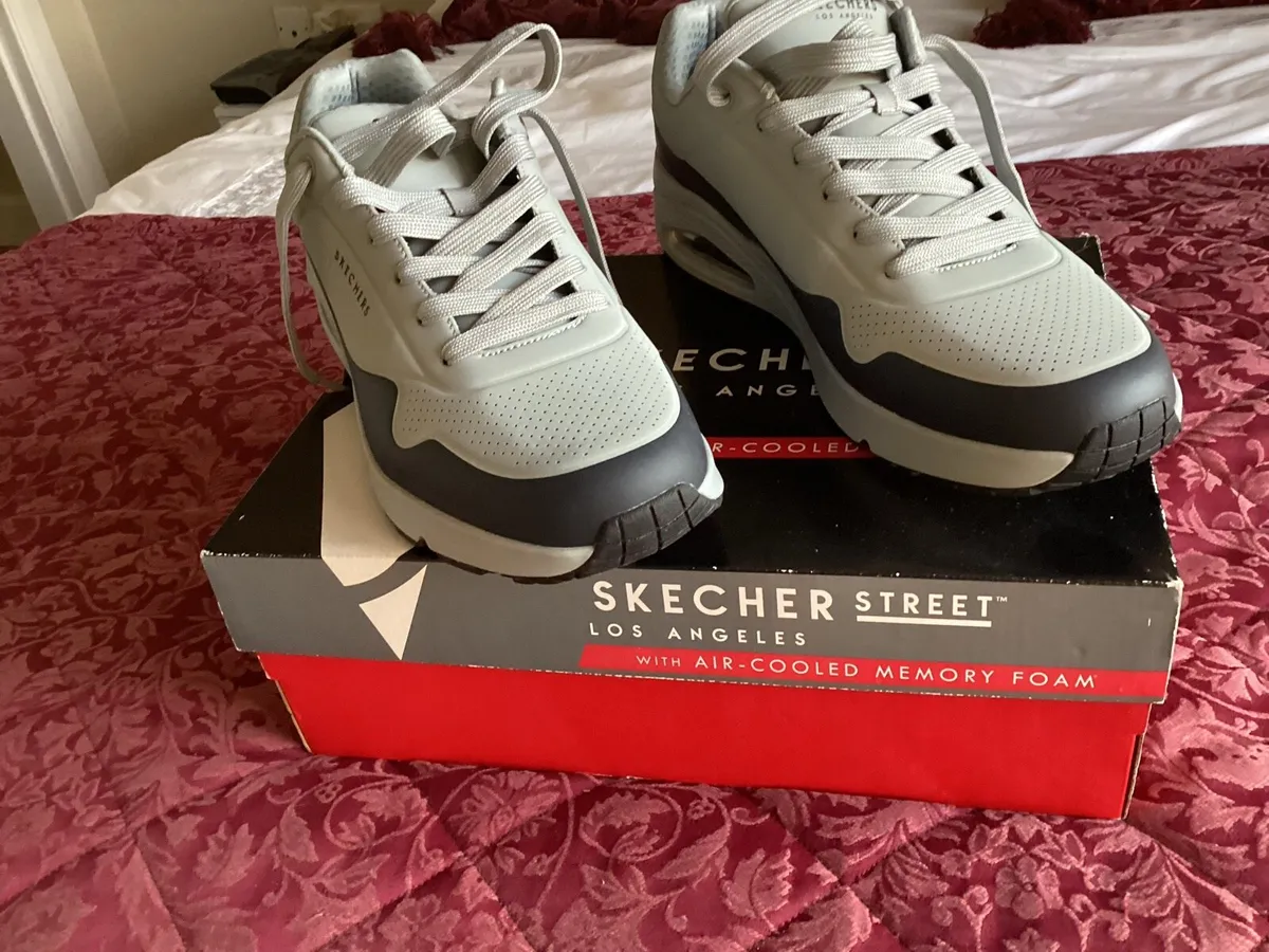 Pair of size 12 SKETCHERS never used