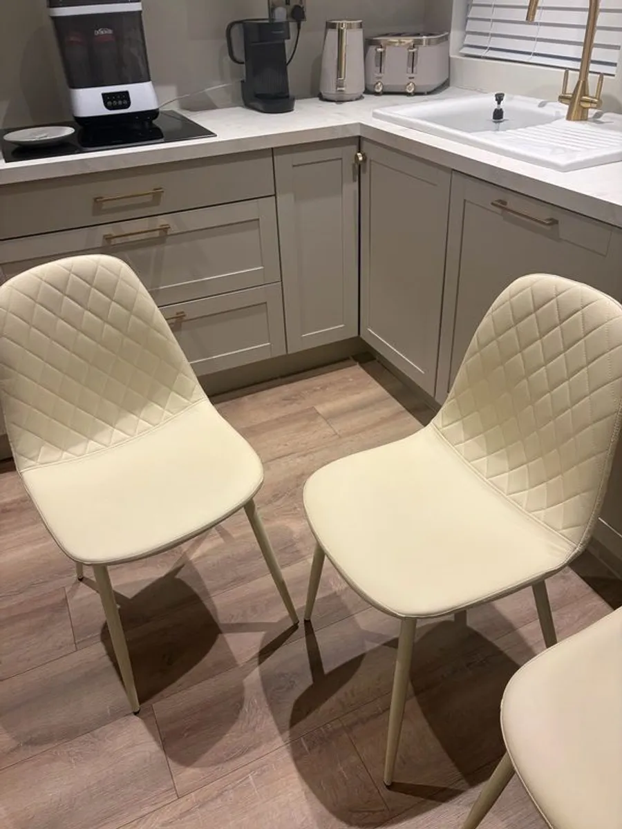 4 cream quilted faux leather dining chairs - Image 1