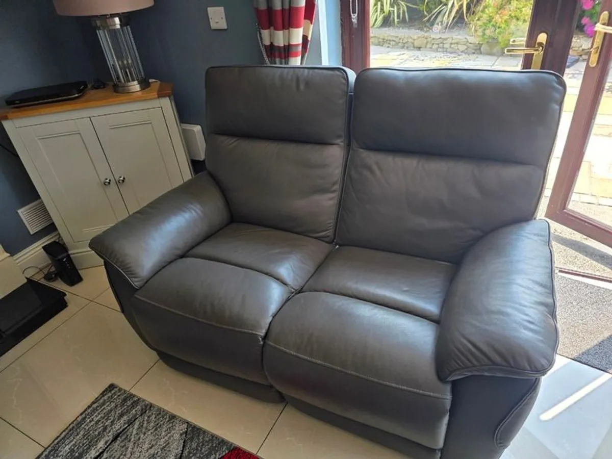 Small dark grey leather sofa for sale