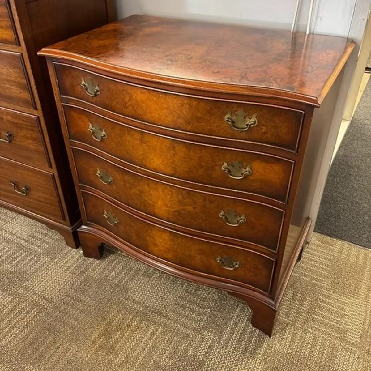 Stunning walnut serpentine chest of drawers