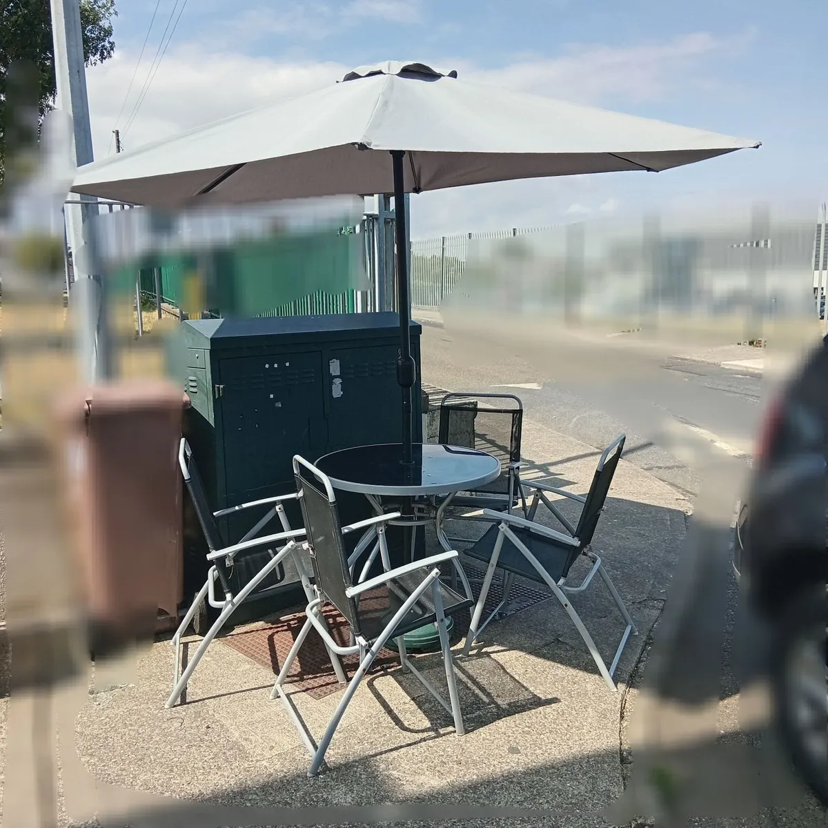 Garage table 4 chairs and umbrella and stand - Image 1