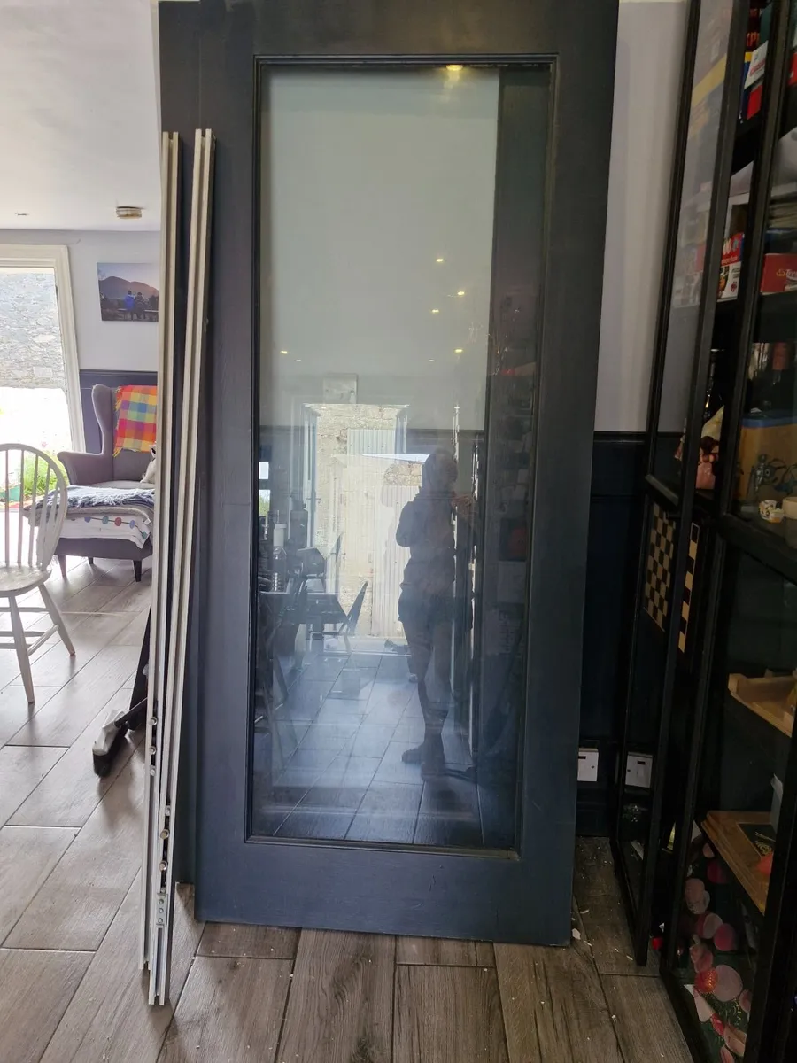 Wood framed glass doors. - Image 1