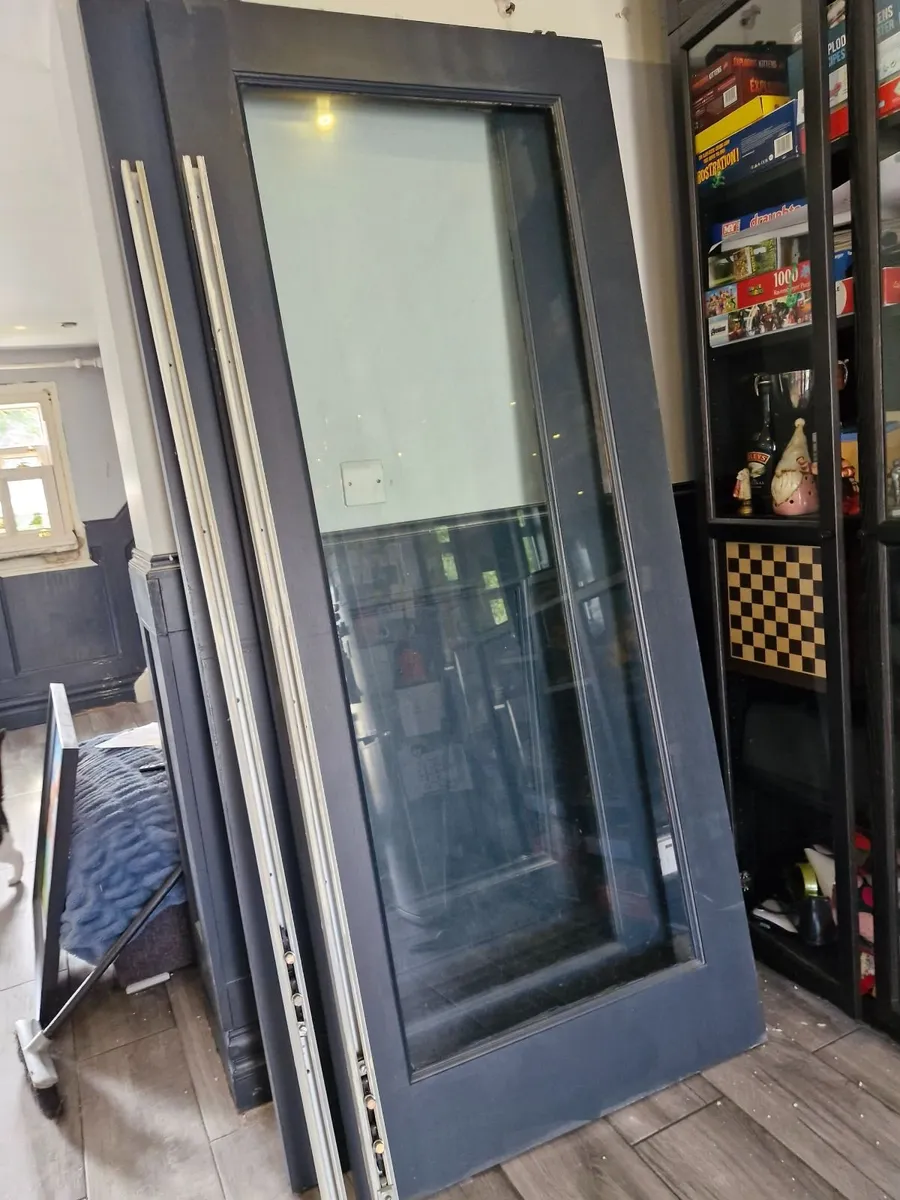 Wood framed glass doors. - Image 2
