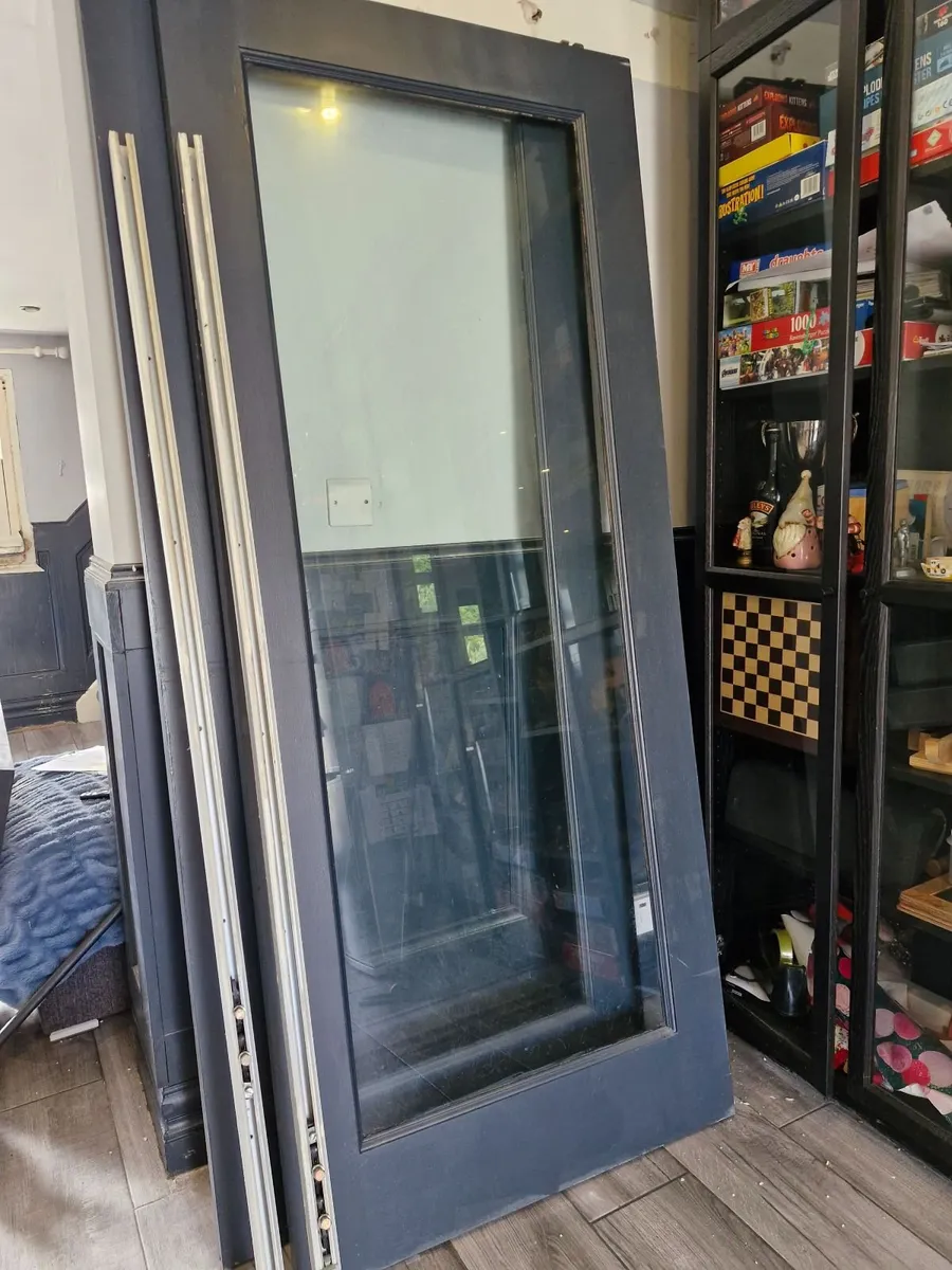 Wood framed glass doors. - Image 3