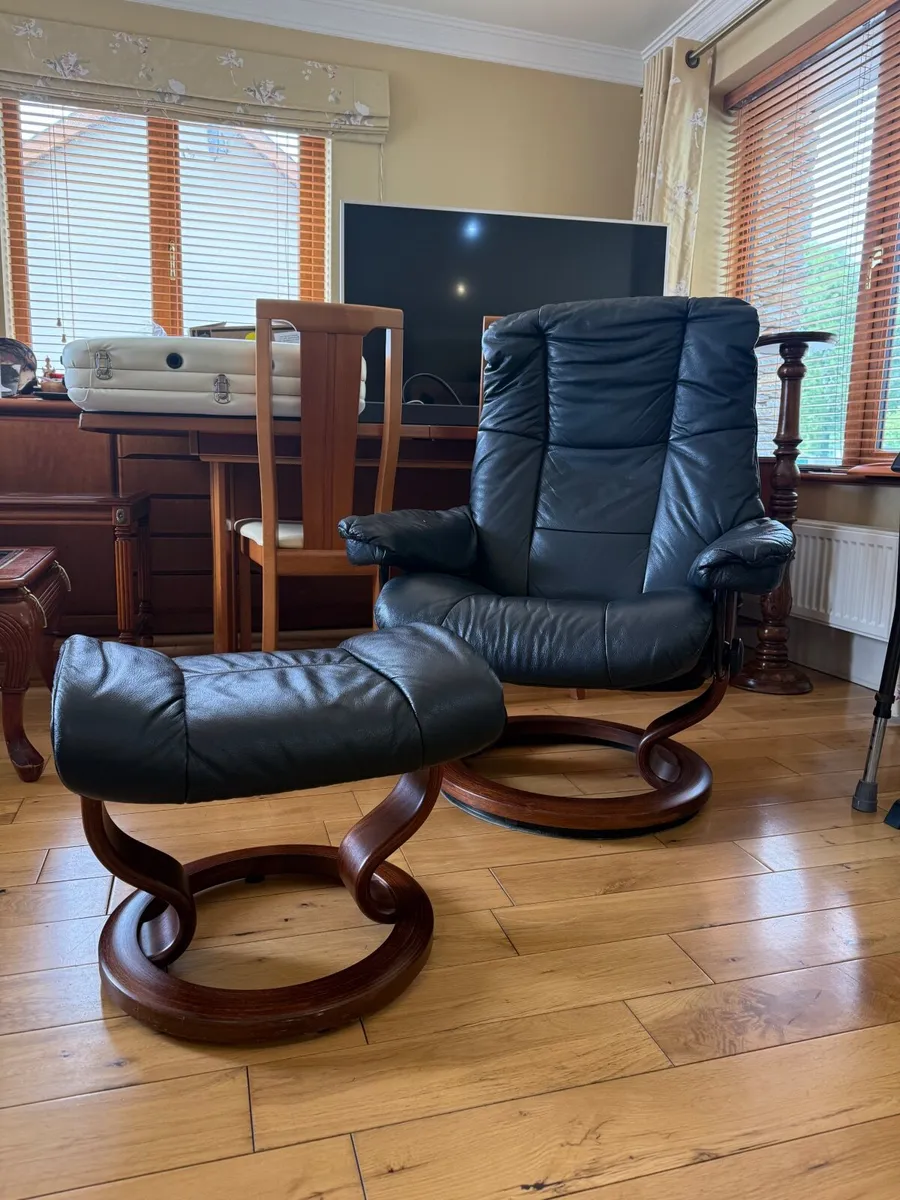 Set of Black Leather Reno Recliner and Ottoman - Image 1