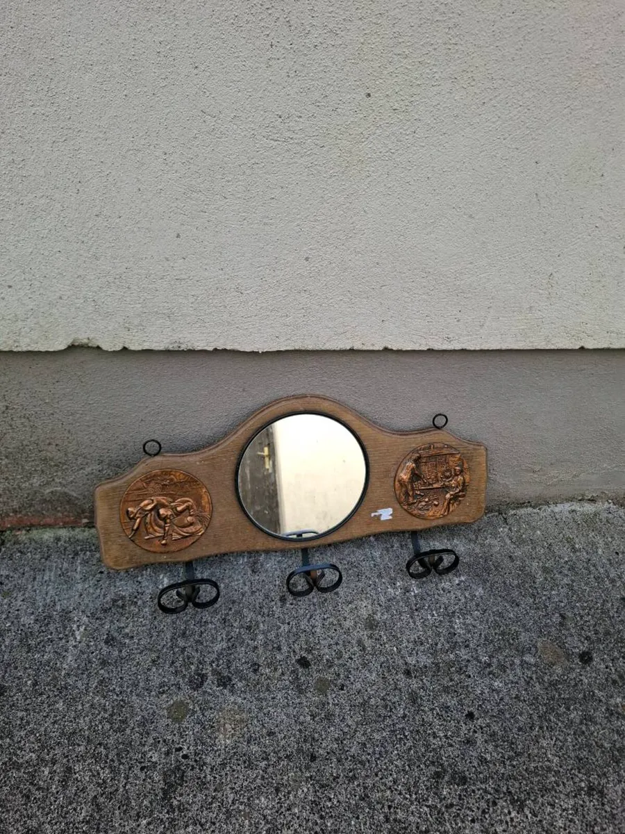 Coat holder with mirror