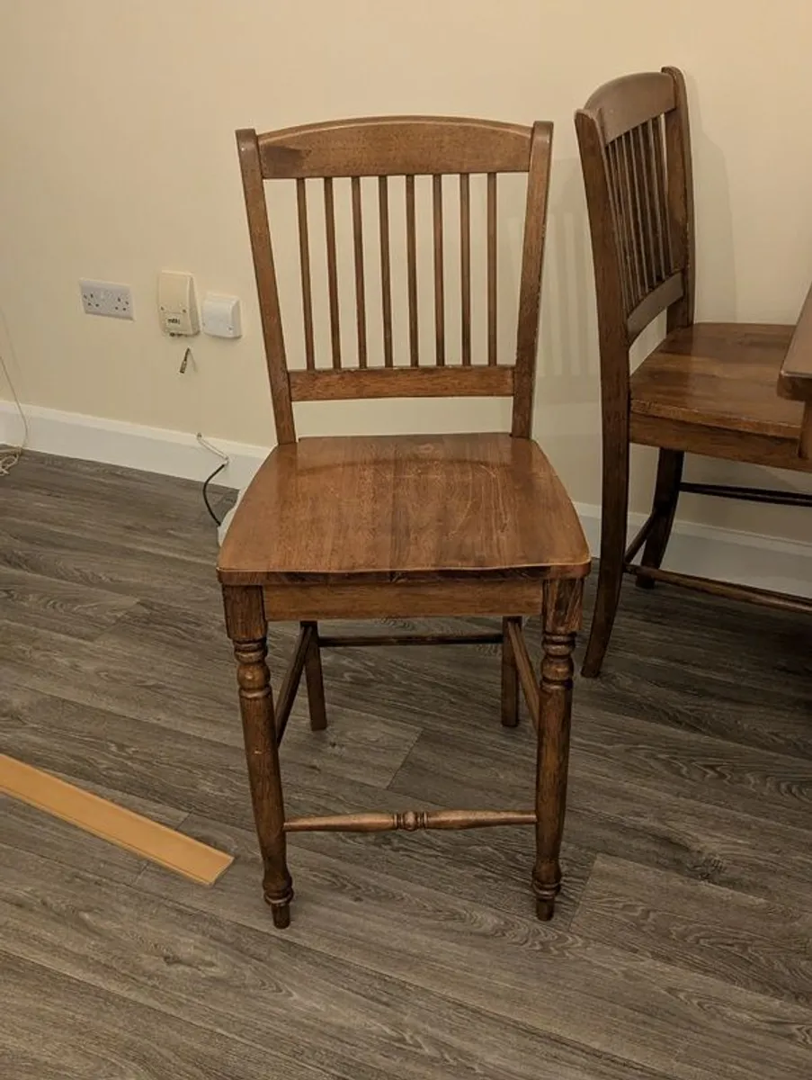 Wooden dining table with tiled top and matching chairs - Image 1