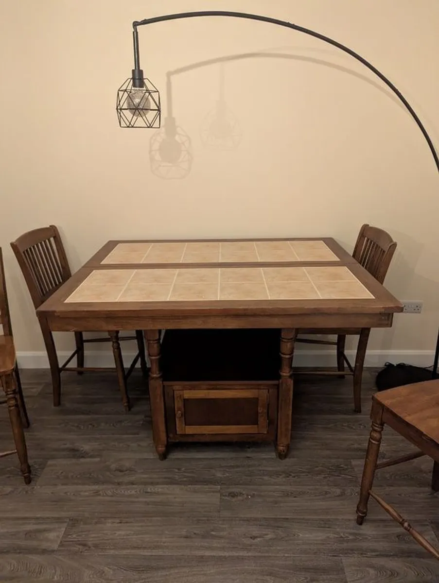 Wooden dining table with tiled top and matching chairs - Image 2