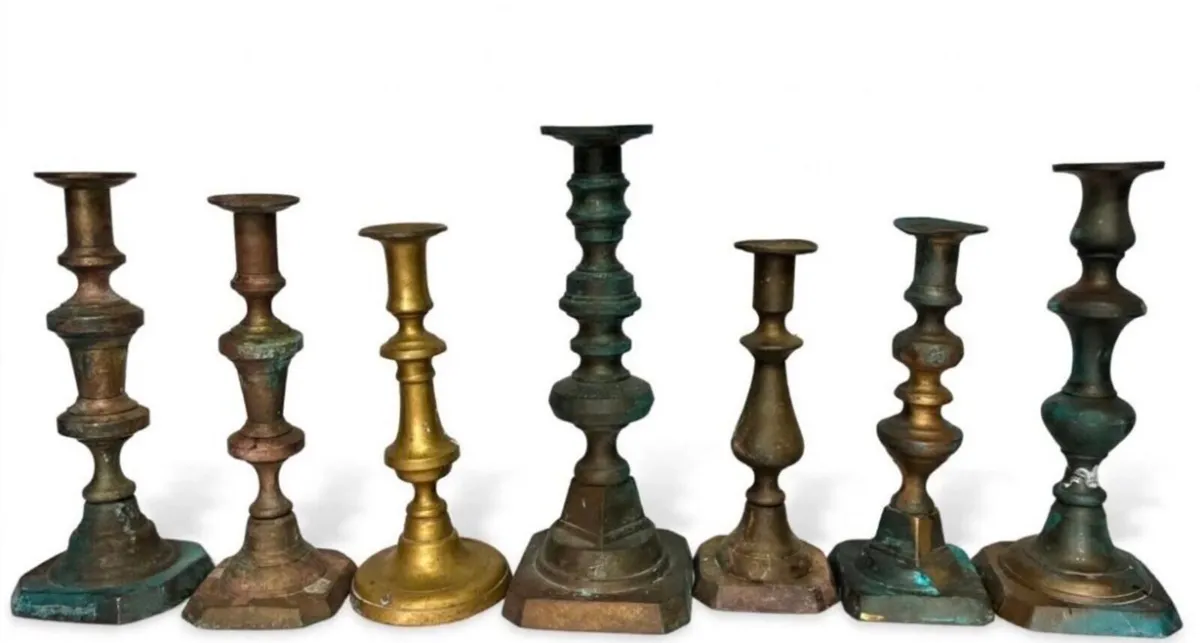 7 antique brass candle holders