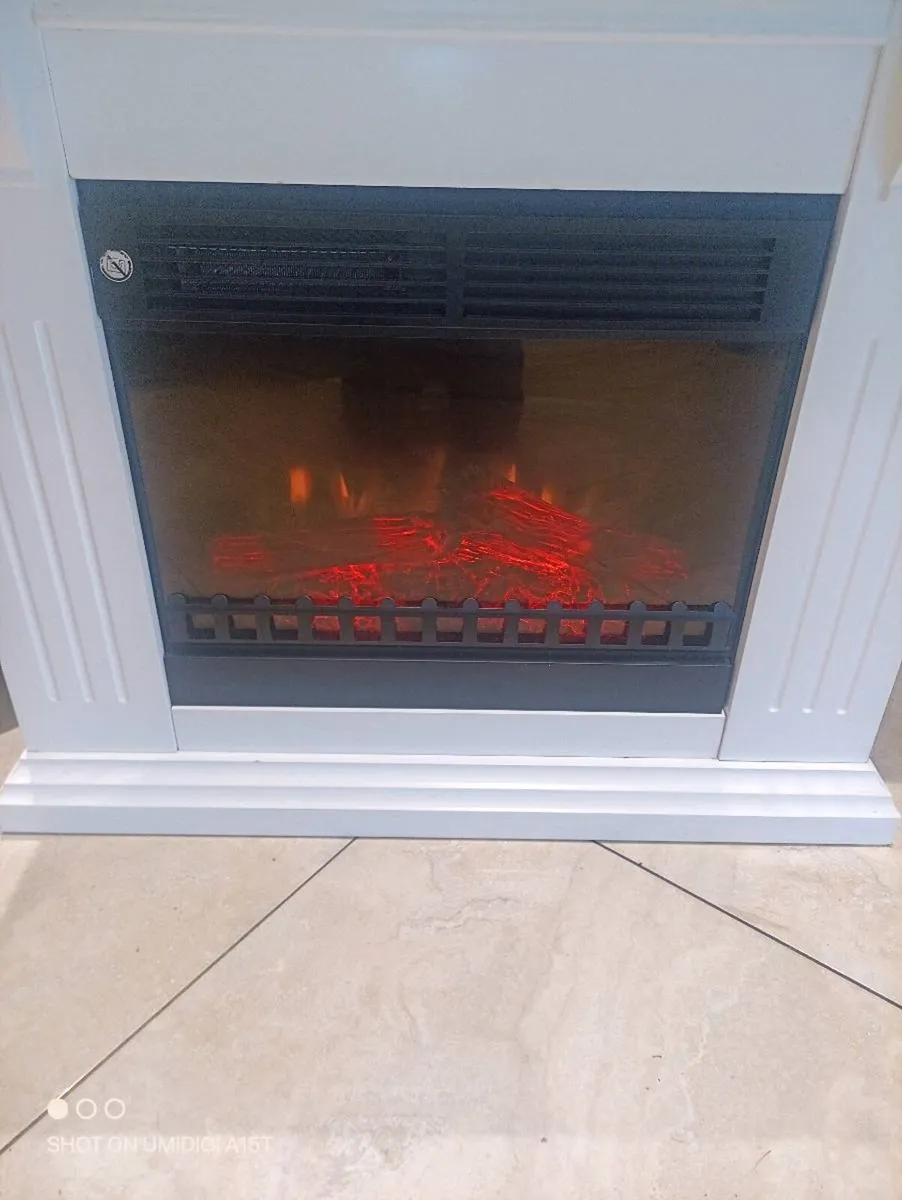 Electric heater with surround - Image 1