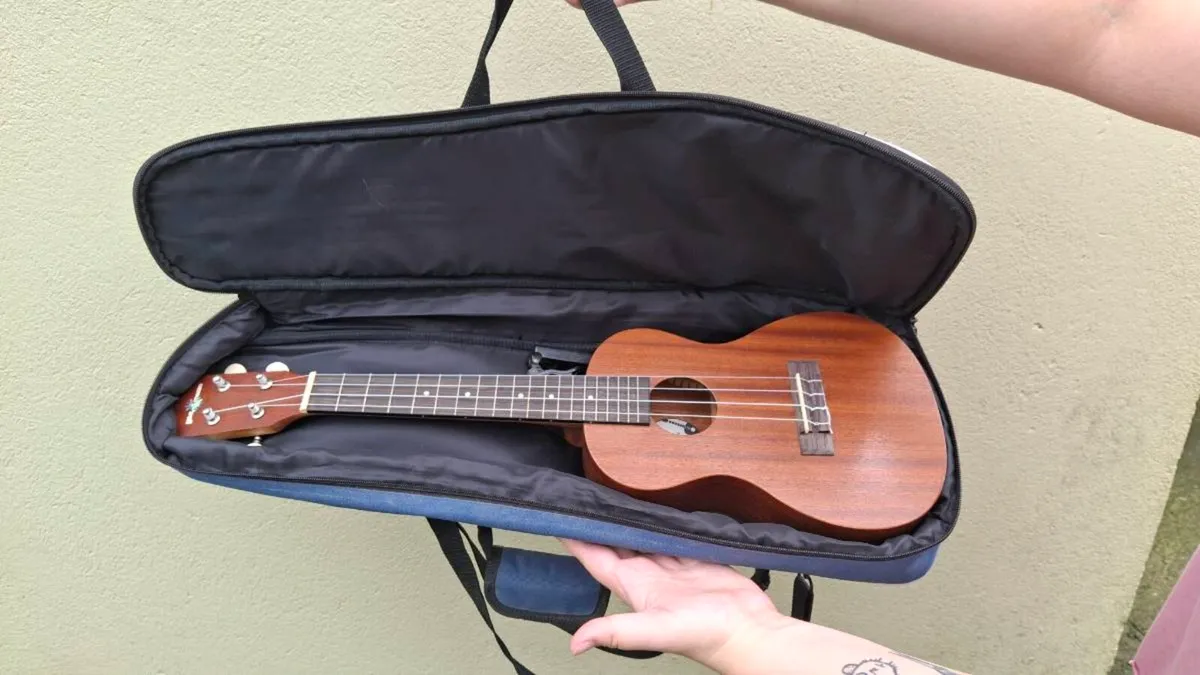 Ukulele with case and tuner - Image 1