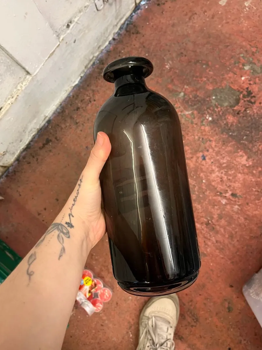 Approx. 40 Clear, Black, Brown, Amber & Gold Vases - Image 1