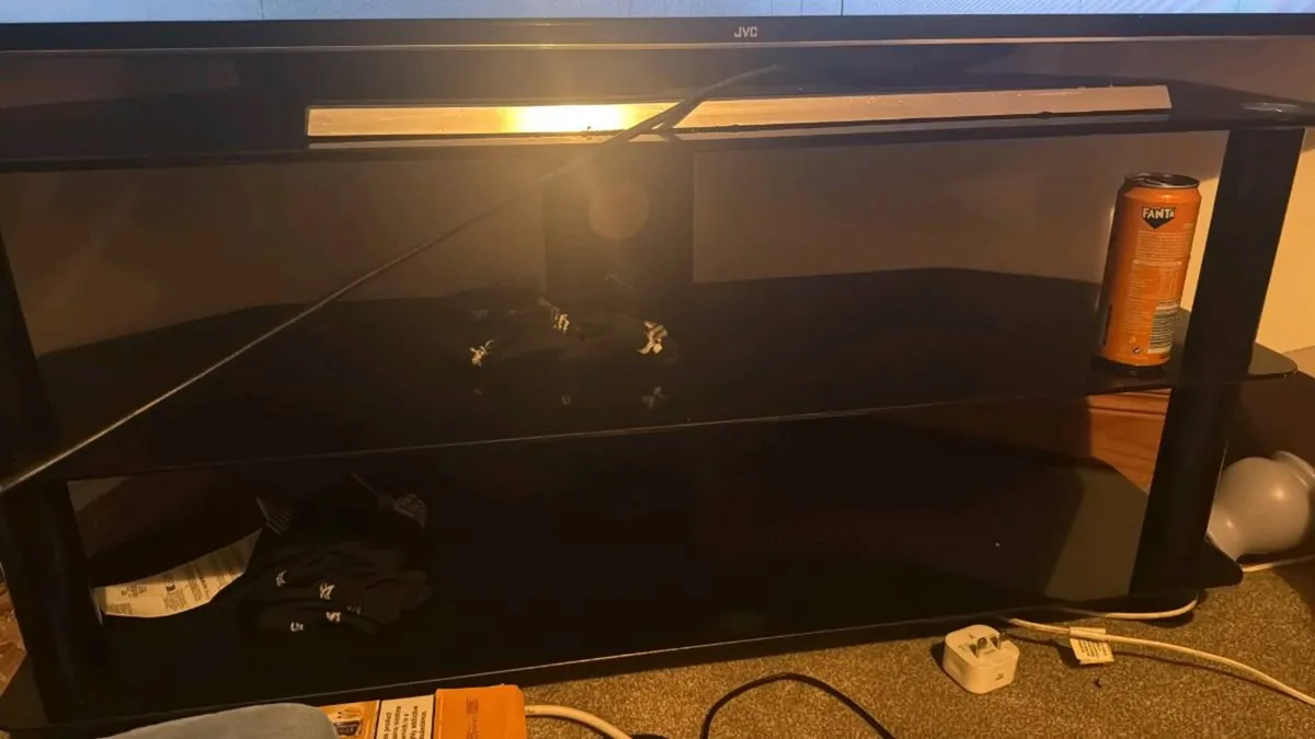 55 inch TV and table - Image 1