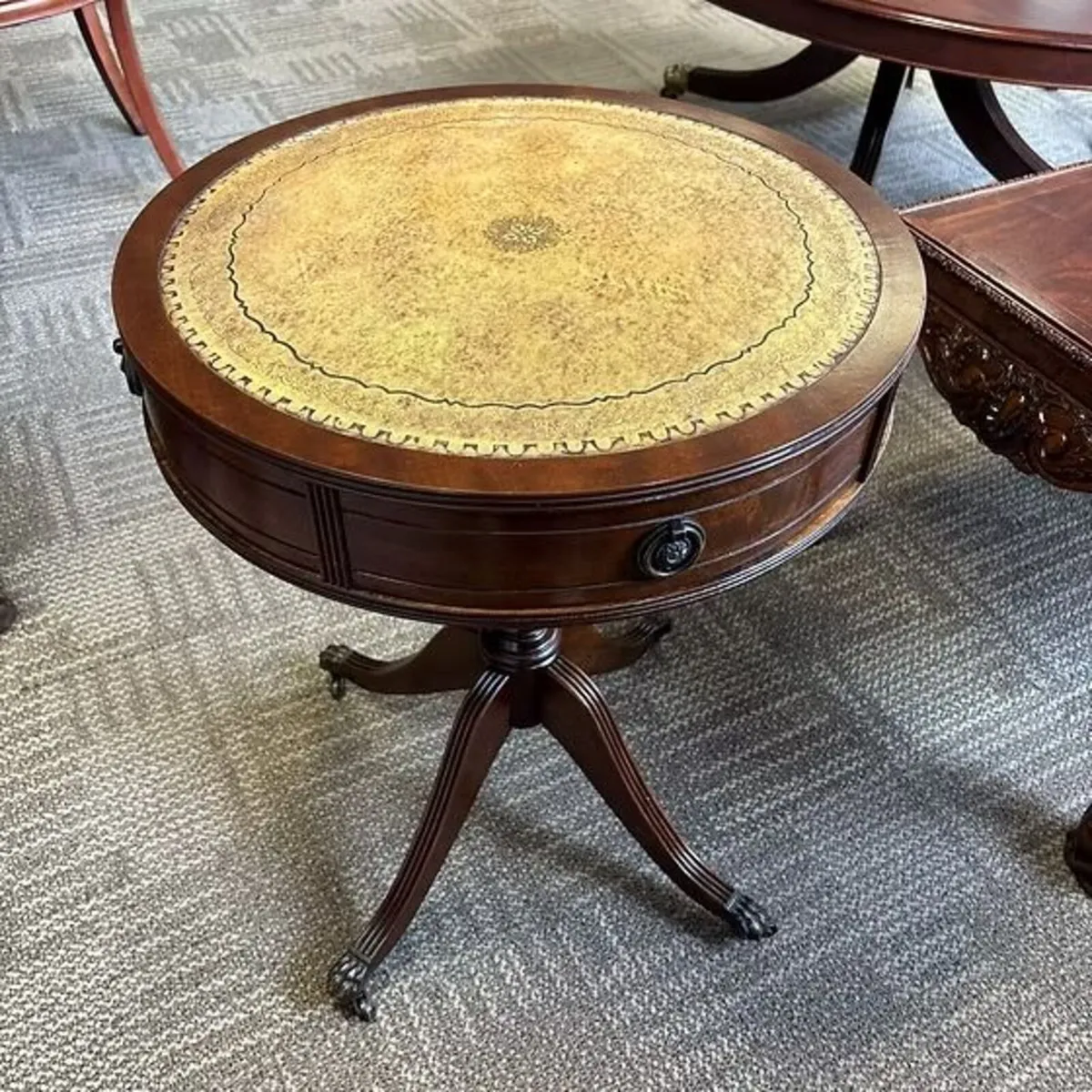 Mahogany drum tan leather top table with two drawe