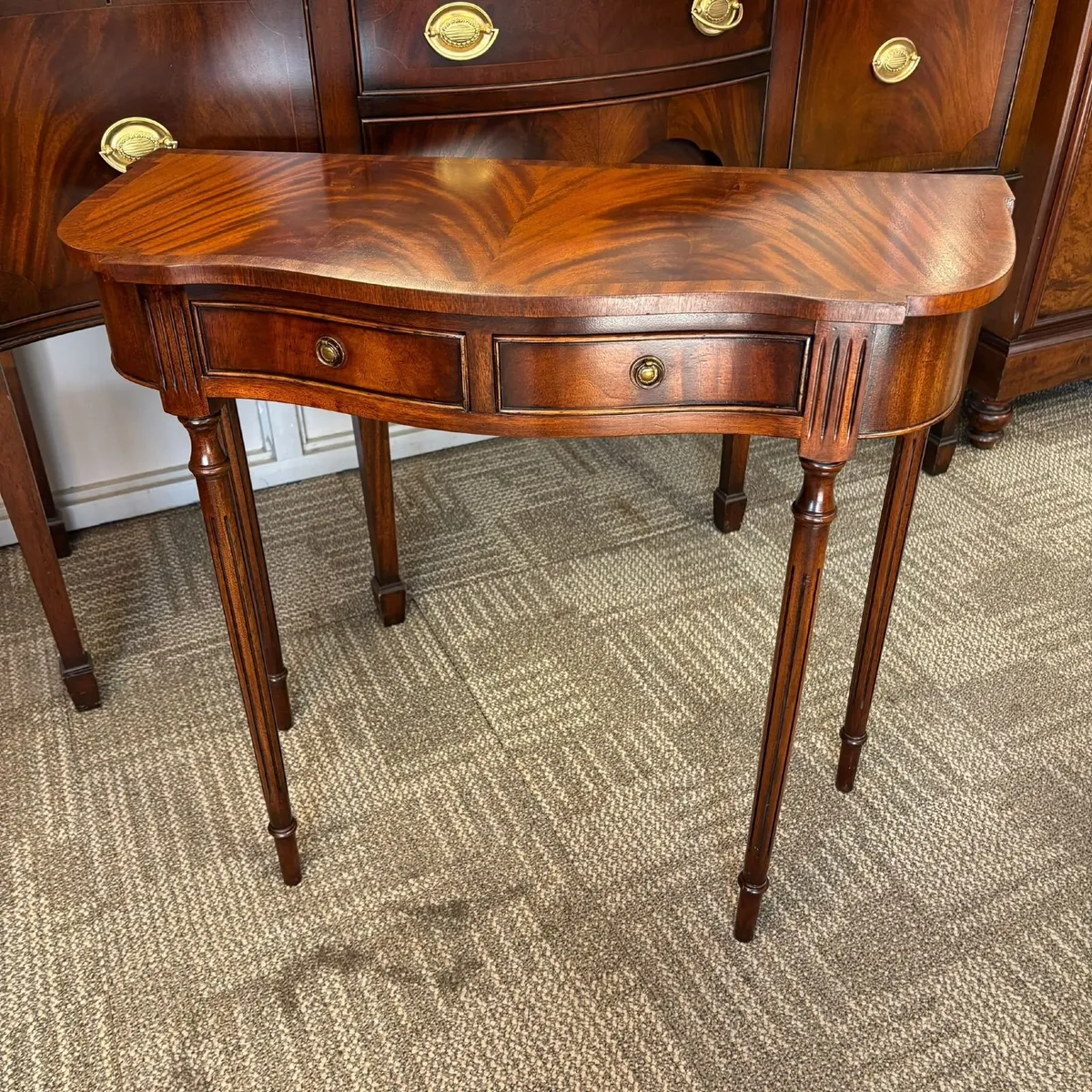 Fabulous mahogany flamed bow ended console table. - Image 1